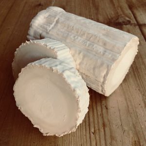 Christmas Beer and Food Pairings. Photograph of a stack of goats cheese
