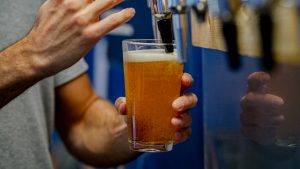 Christmas Beer and Food Pairings. Photograph of a beer being poured into a Belleville glass