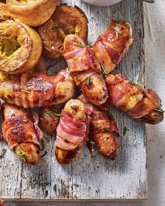 Christmas Beer and Food Pairings. A photograph of sausages wrapped in bacon