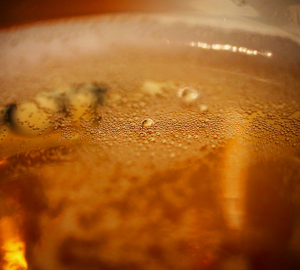 How to drink beer like a pro? Close up photograph  of bubbles inside of a beer glass